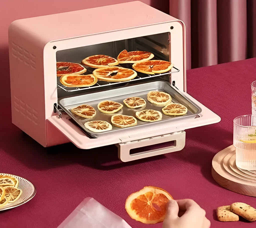 Pink home kitchen electric oven with up and down heating, 4-5 person capacity, 260x205x171mm, on countertop
