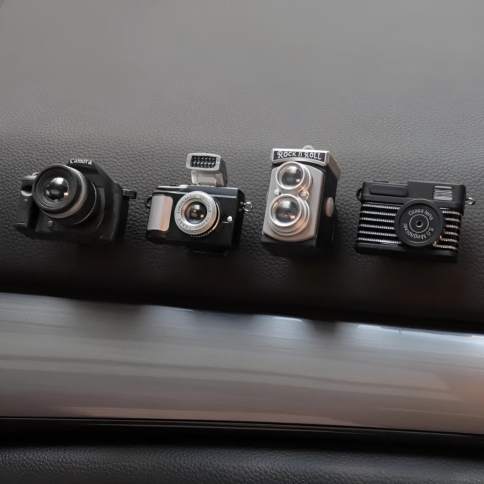 Four retro camera dot design adhesive hooks for car interior organisation measuring 4.2x2.5cm