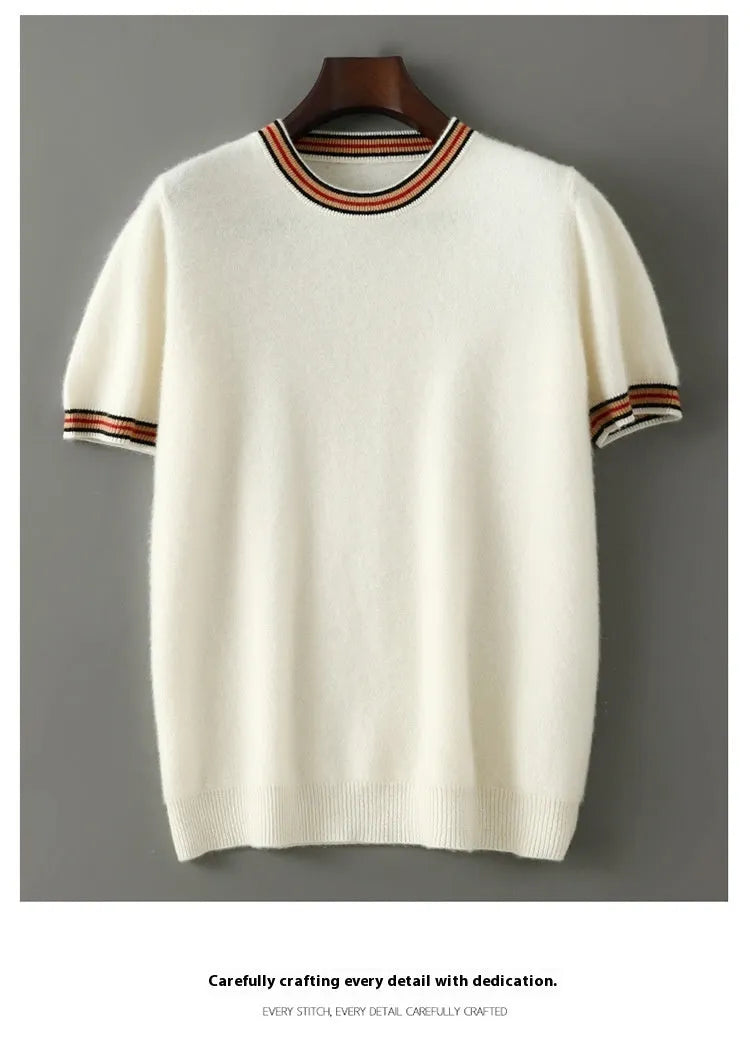 A man's short sleeve grey wool jumper with a round neckline on a hanger.