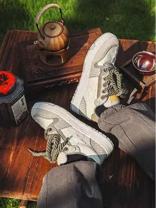 Green low-top casual sneakers with white star pattern stitching, round toe, and flat rubber sole on a white background.