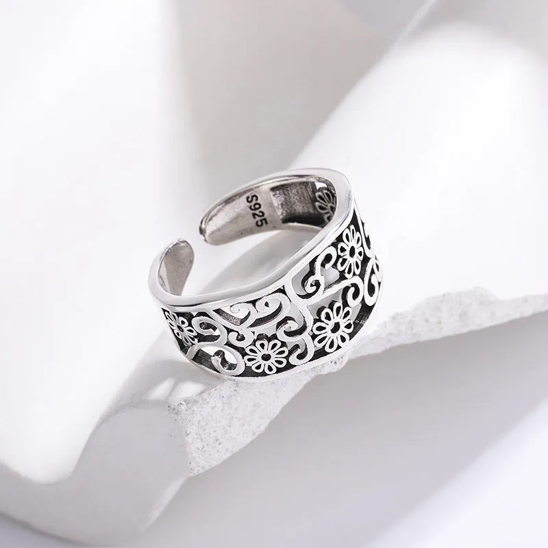 Silver plated open ring with hollow flower design, adjustable opening, retro style, colour retro JZ02137