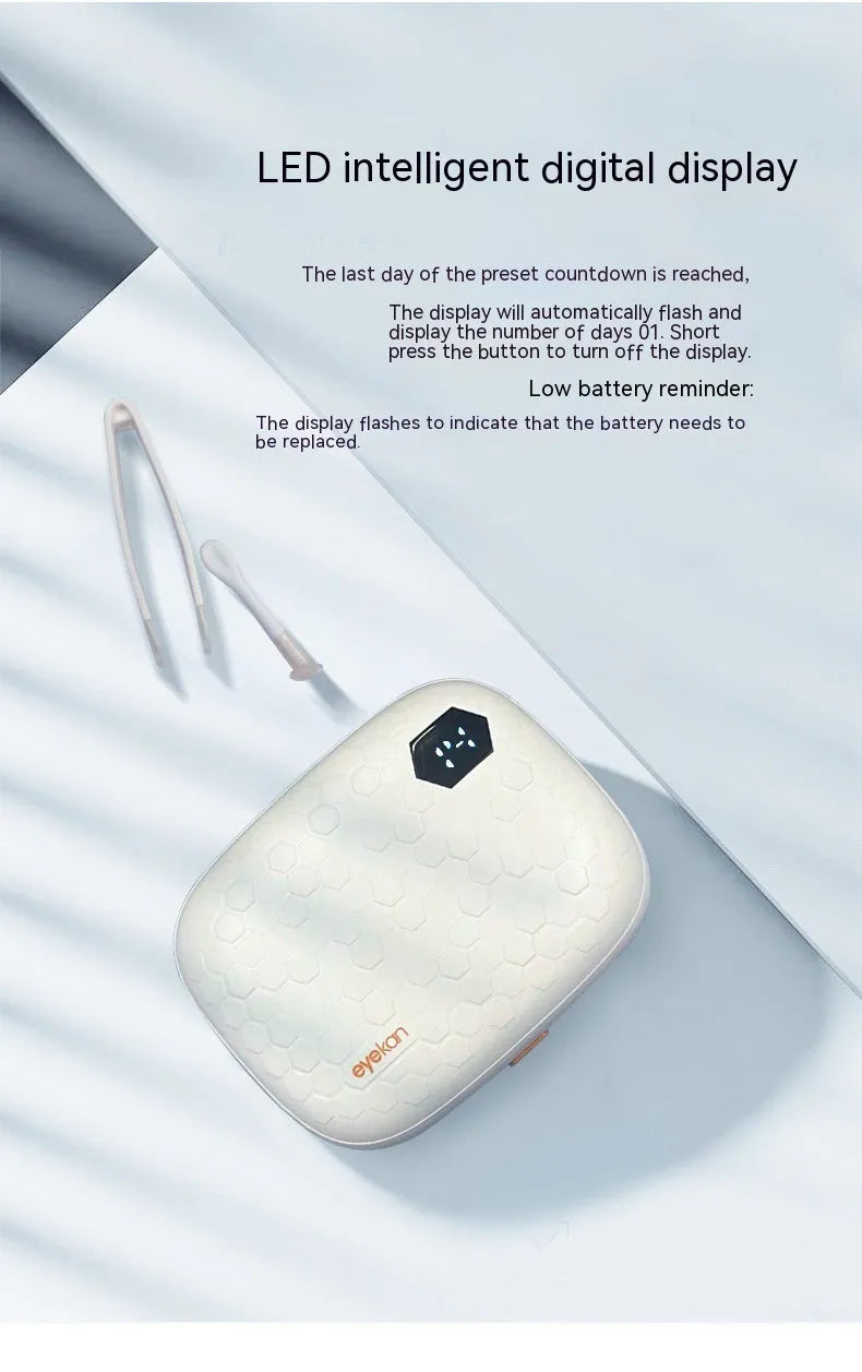 Pearl white automatic ultrasonic flushing instrument for cleaning invisible glasses on a table.