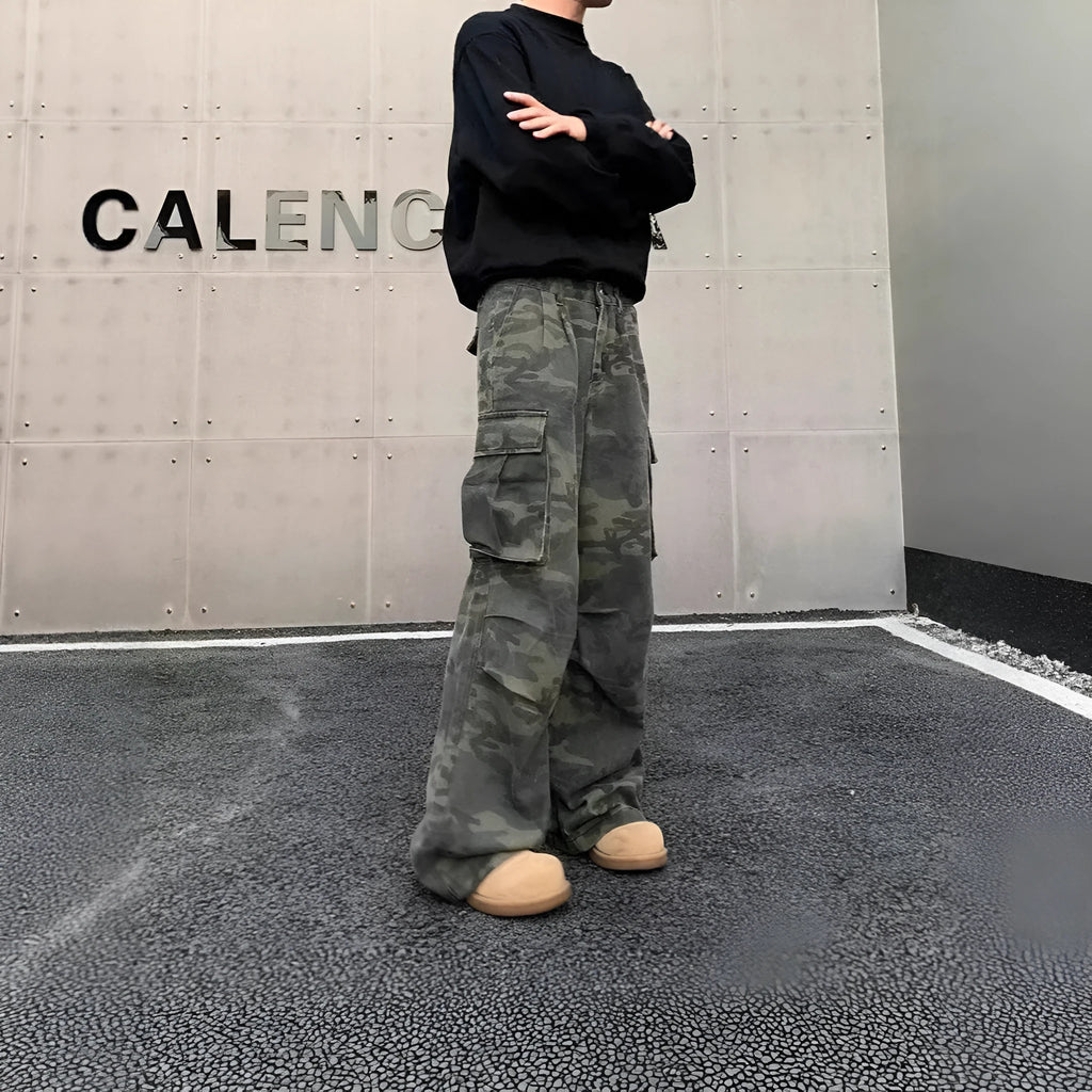 Men's washed camouflage print cargo trousers with multiple pockets and a mid waist design.