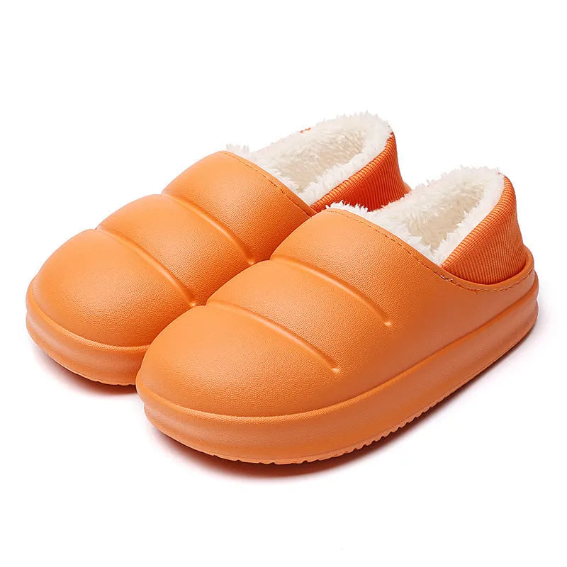 Women's winter slippers in green with plush lining and textured EVA sole, shown as sleeve-style overshoes.