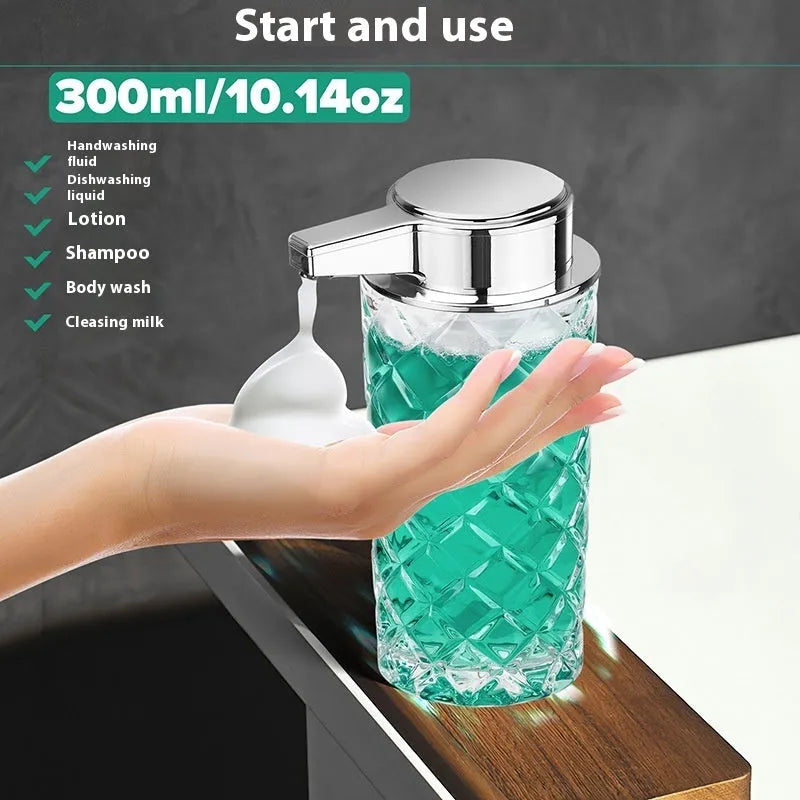 Silver automatic soap dispenser with USB Type-C charging port on a bathroom countertop.