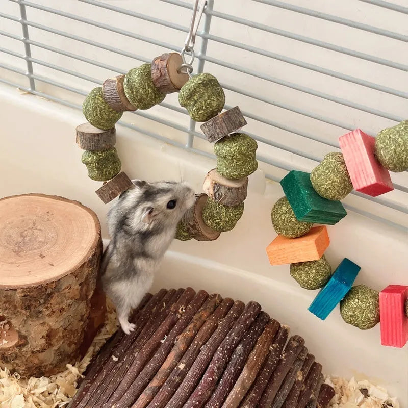 Hamster toy set showing decorative straw ball rings and applewood molar bite rod for small animal enrichment