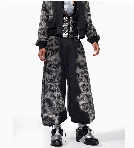 Women's grey loose-fit co-ord set with collage-stitch hoodie, matching trousers, and seven-inch shorts on a hanger.