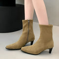 Brown square toe ankle boot with a side zip and a waterproof platform kitten heel.