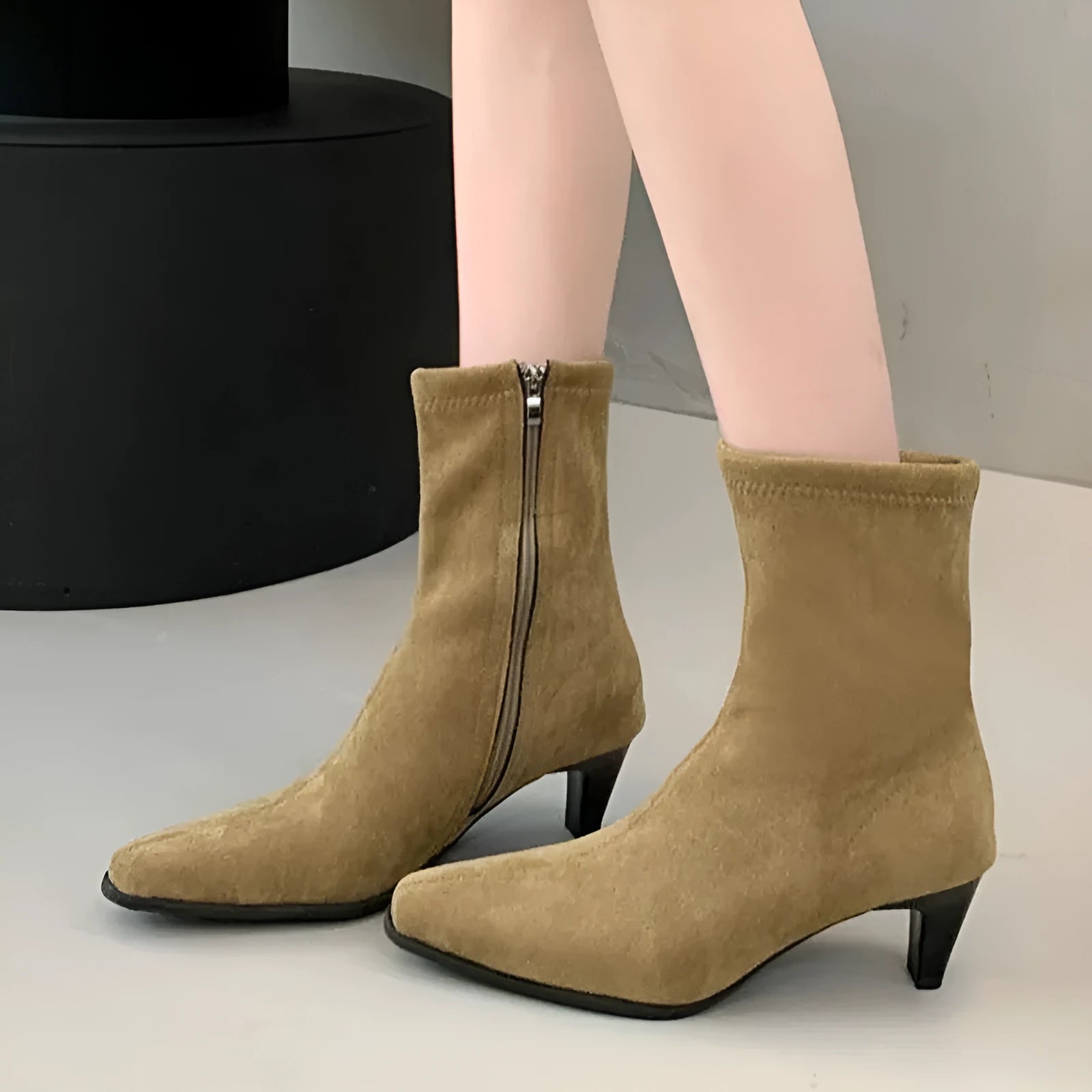 Brown square toe ankle boot with a side zip and a waterproof platform kitten heel.
