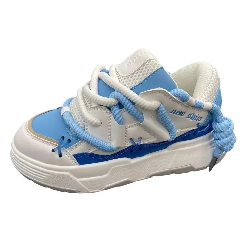 Women's grey retro chunky sneakers with thick sole and front lace-up, shown on a foot