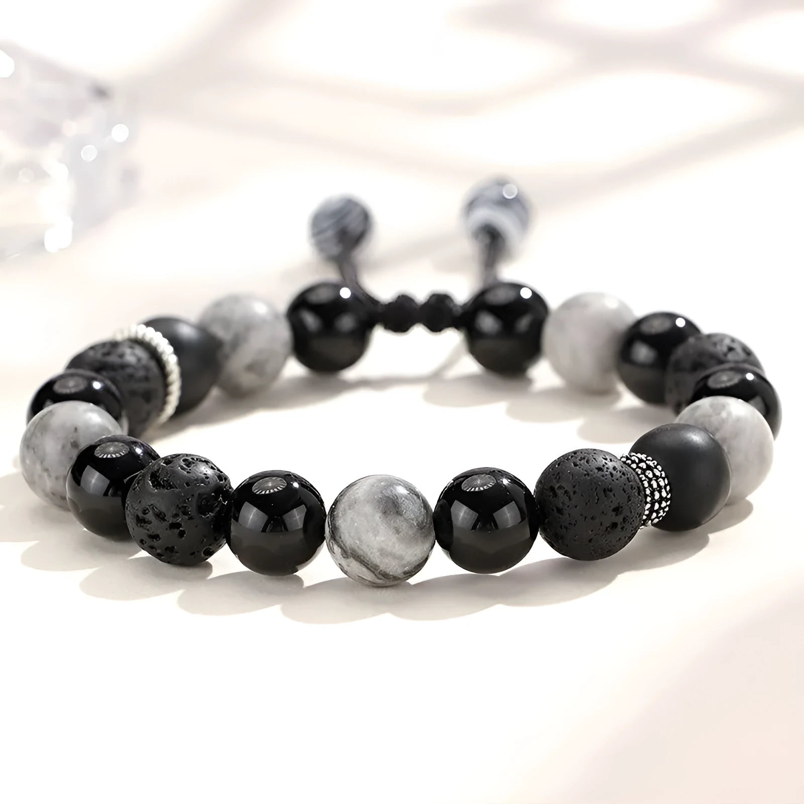 Black agate map stone volcanic rock bracelet with diamond shape and electroplated metal, shown in 8mm and 10mm sizes
