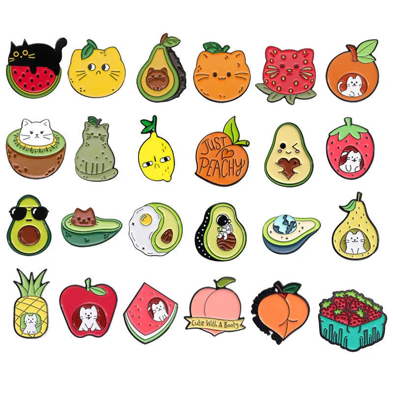 Colourful cartoon-style fruit metal brooch with a pin back on a denim jacket lapel.