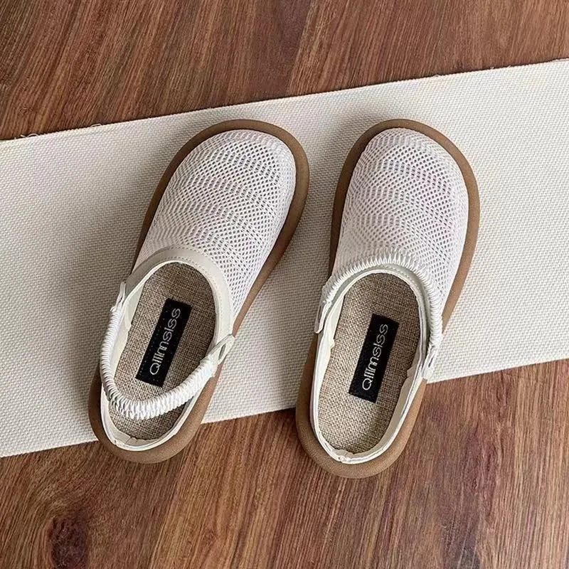 Breathable linen and mesh slip-on shoe with a soft rubber sole in milky white colour.