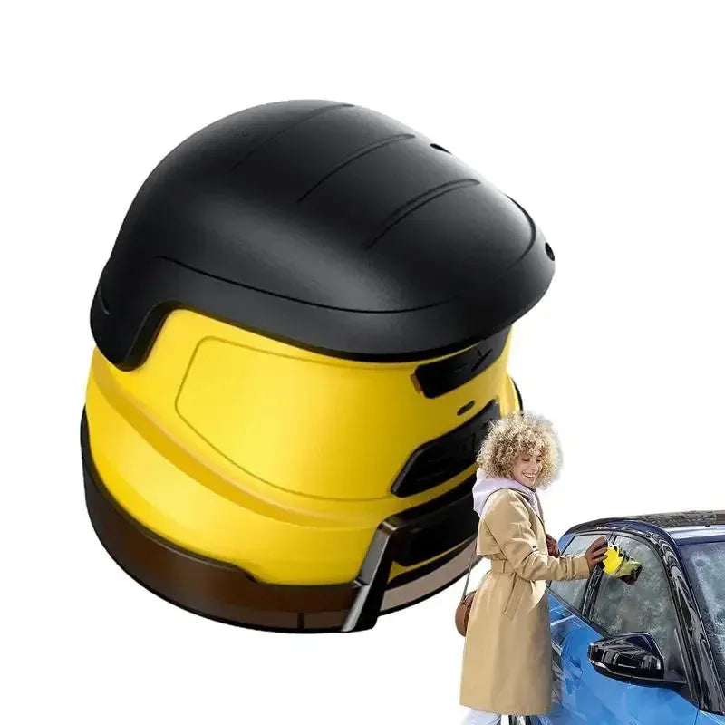 Yellow cordless electric car ice scraper with USB charging cable on a frosty car windscreen.
