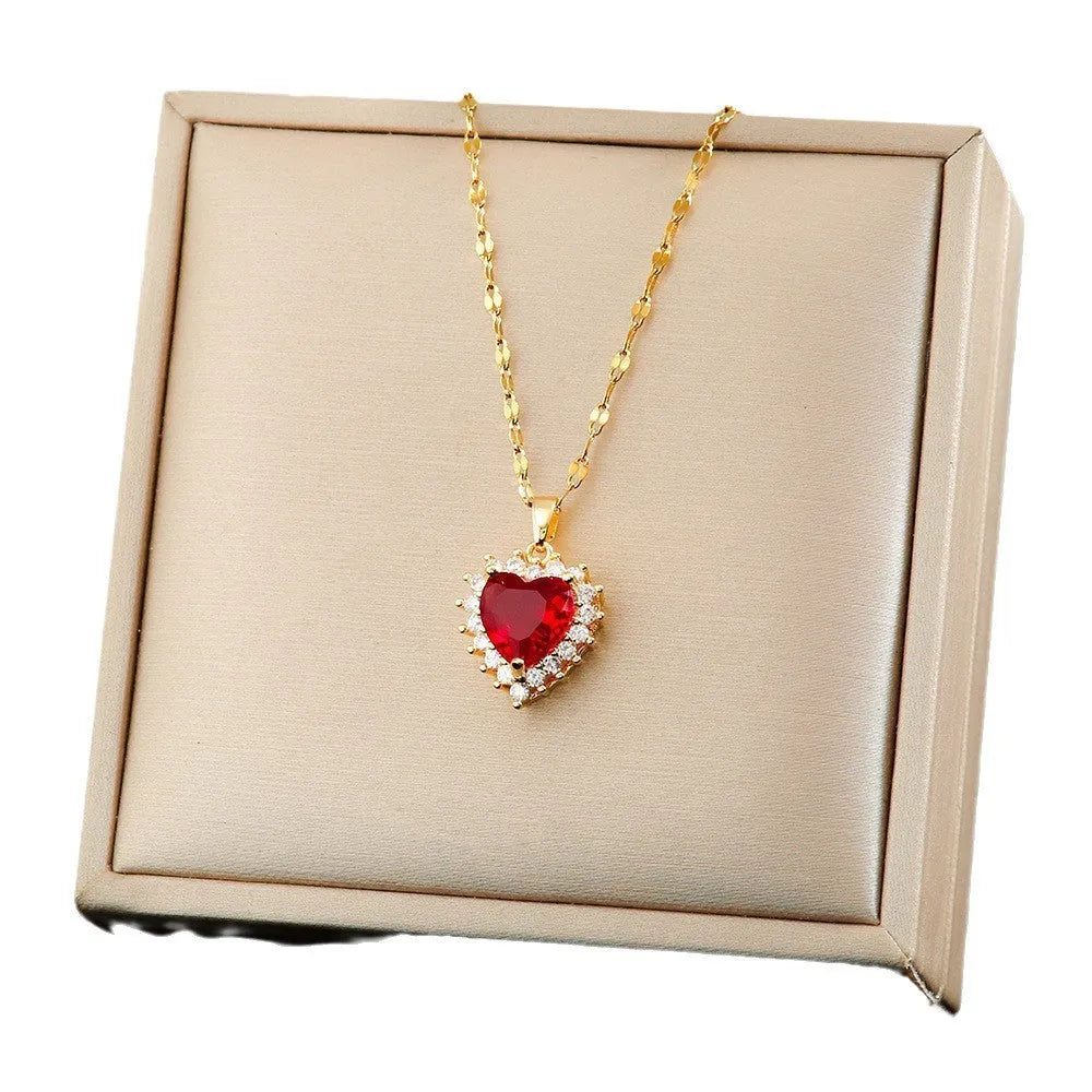 Gold-red heart and flower pendant necklace, earrings, and ring set with gemstone inlay on a titanium steel chain.