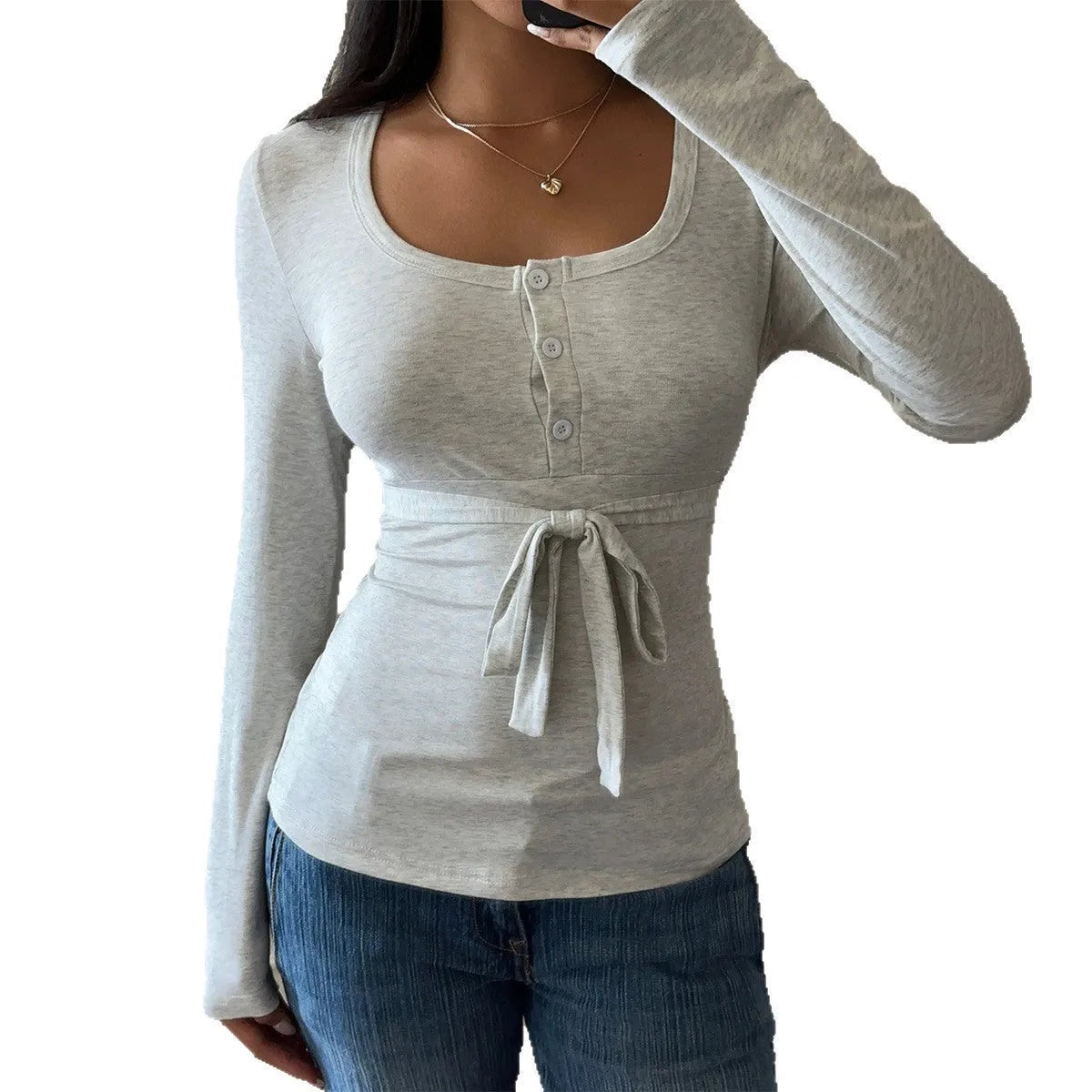 Women's gray slim fit long sleeve base layer t-shirt on model, front view