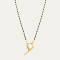 Gold plated copper twin necklace with braid rope chain and emerald-coloured geometric ellipse pendant for women