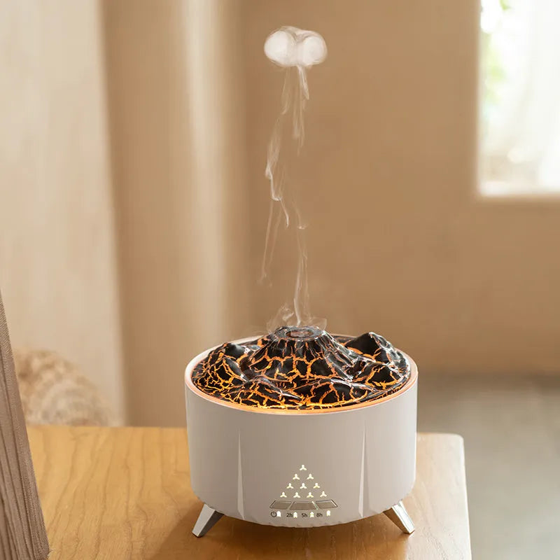 White flame aroma diffuser with Bluetooth speaker and remote control on a table
