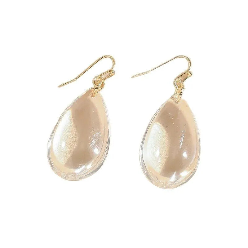 Transparent glass or crystal teardrop drop earrings with irregular shape and cold-tone finish for women