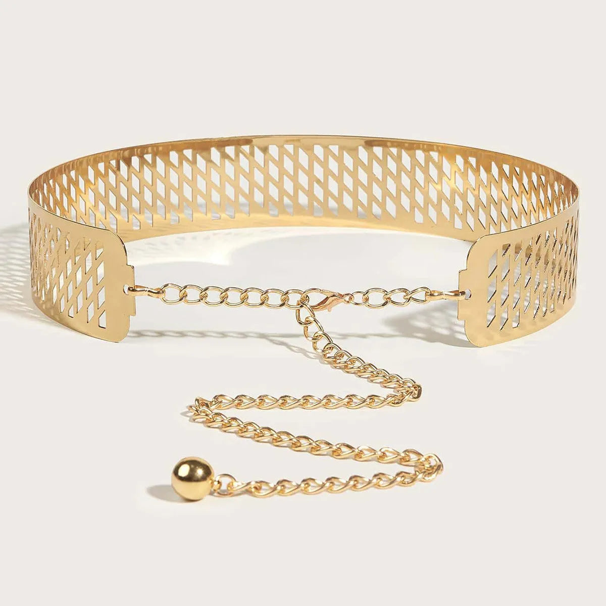 Gold chunky metal waist belt with lantern-head design, 4.5cm wide and 105cm long with hook buckle.