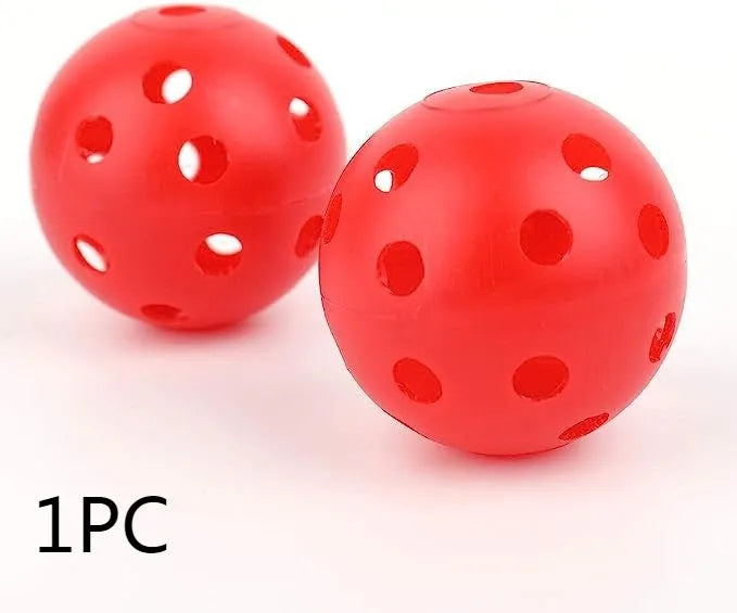 Six multi-coloured golf practice balls in red, orange, blue, green, white, and yellow, shown in a net bag.