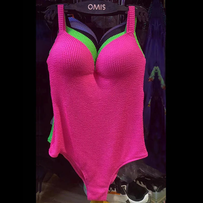 Women's sleeveless one-piece swimsuit with stripe print in various colours on a mannequin
