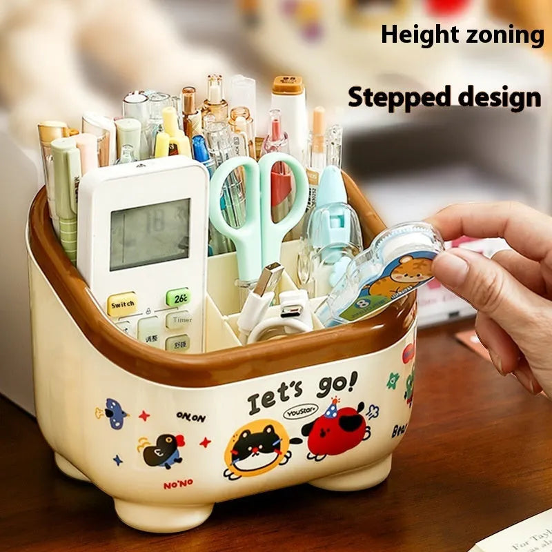 Cartoon-style plastic desktop organiser with grid compartments and red or brown stickers.