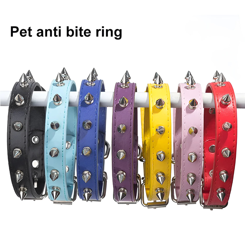 Close-up of a studded black PU leather dog collar with metal spikes and a silver alloy buckle fastener.
