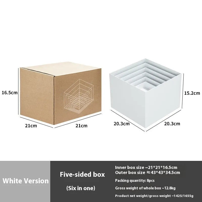 Six white plastic cube dessert display stands arranged on a table.