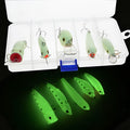 Set of five fluorescent green and orange 3D hard bait fishing lures on a blue background.