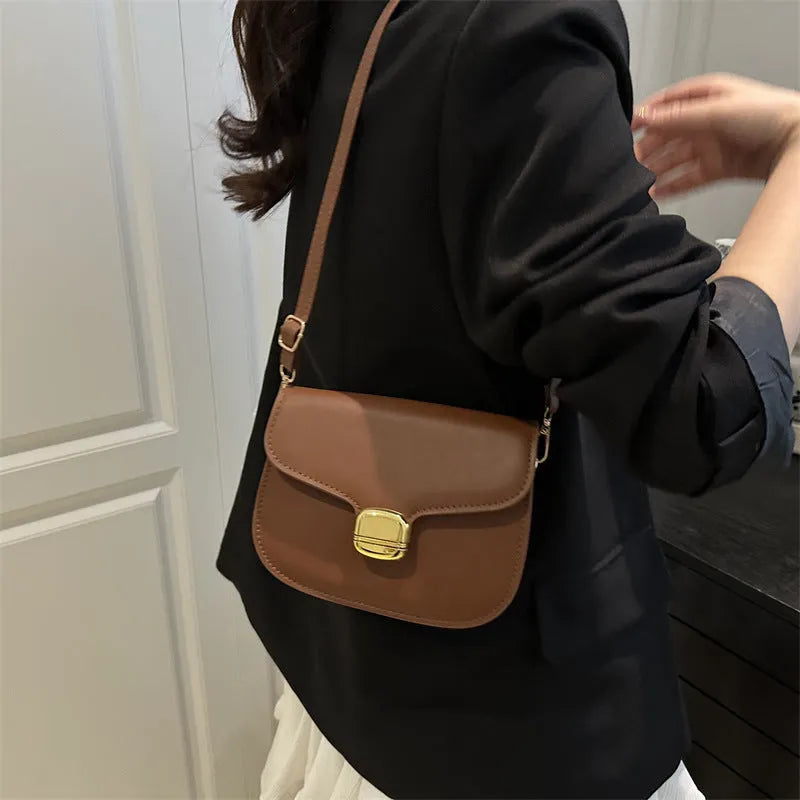 Simple PU leather women's handbag showing internal zipper pocket and phone compartment