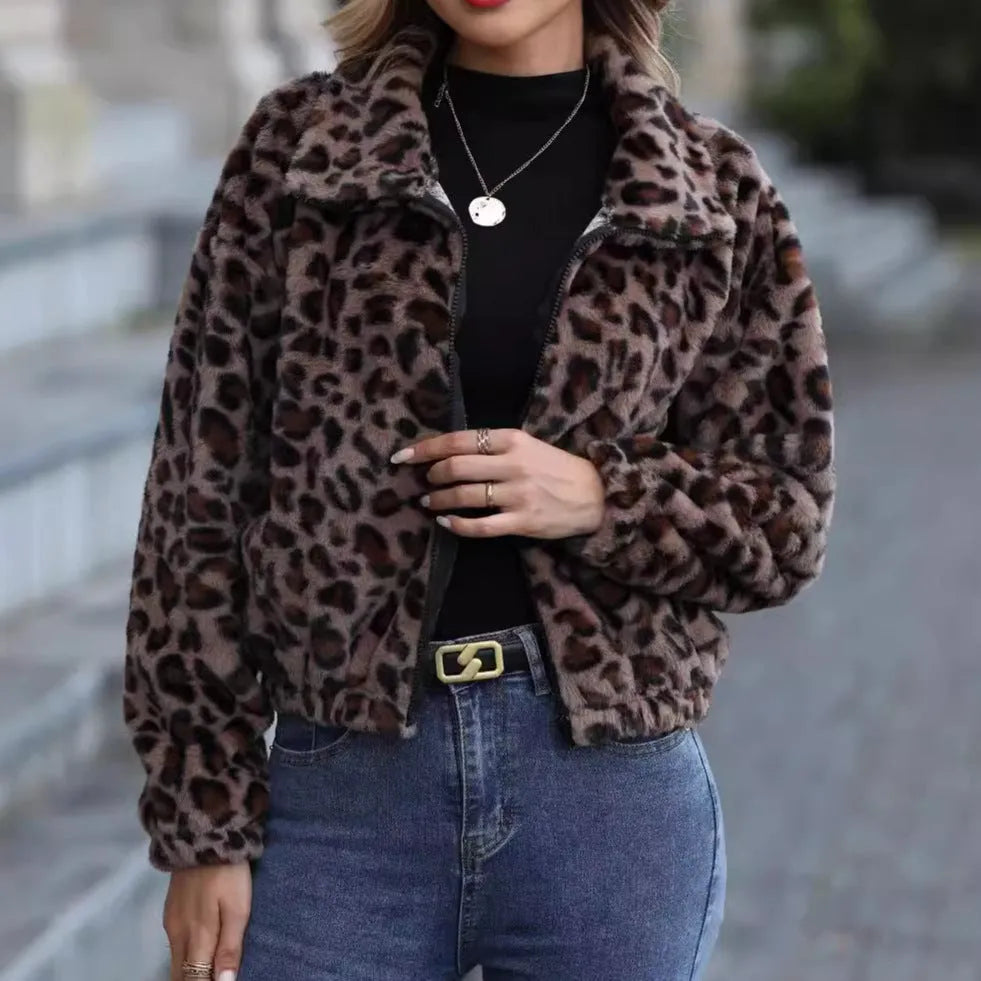 Women's loose fit leopard print plush coat with front zip and long sleeves.
