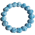 Blue hand-crafted bodhi bracelet with a pearl accent, showing bead sizing options.