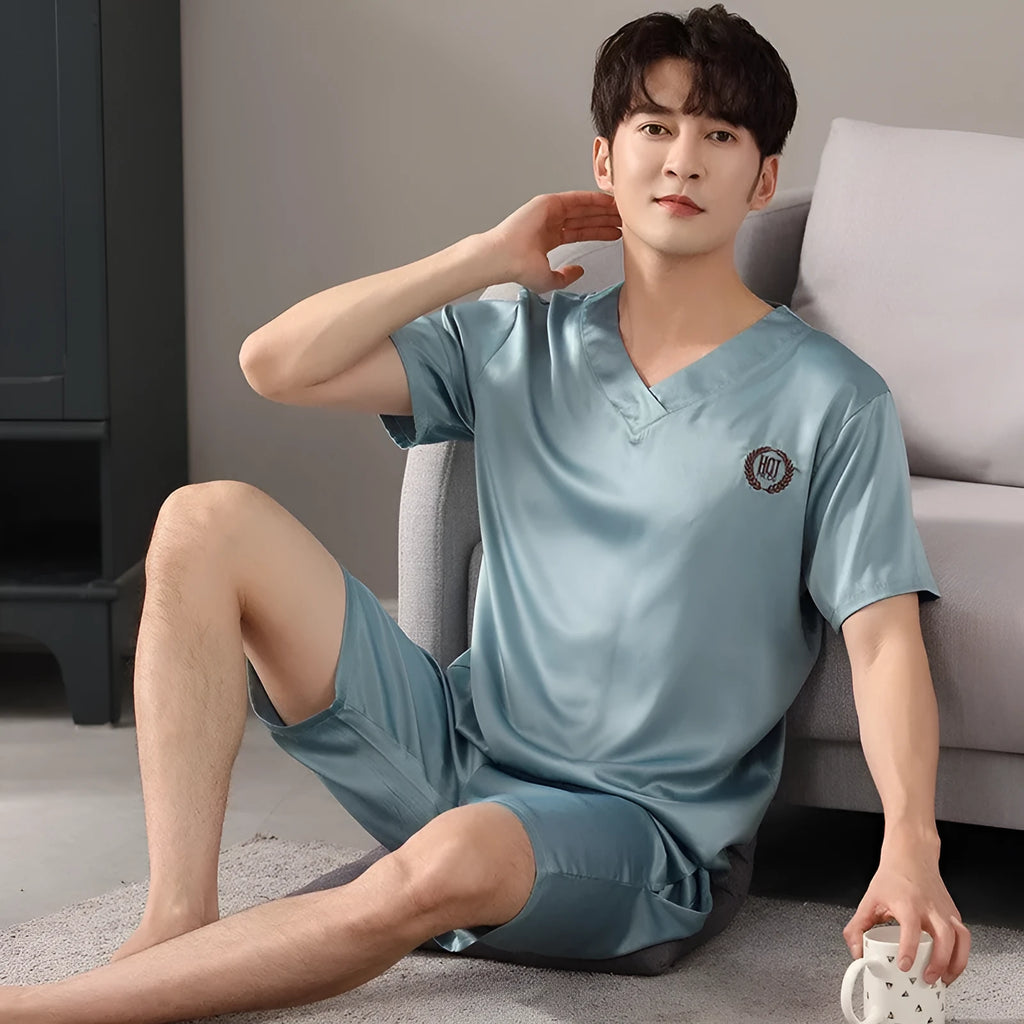 Men's loose fit ice silk short-sleeve pajama shirt and shorts set on a hanger.