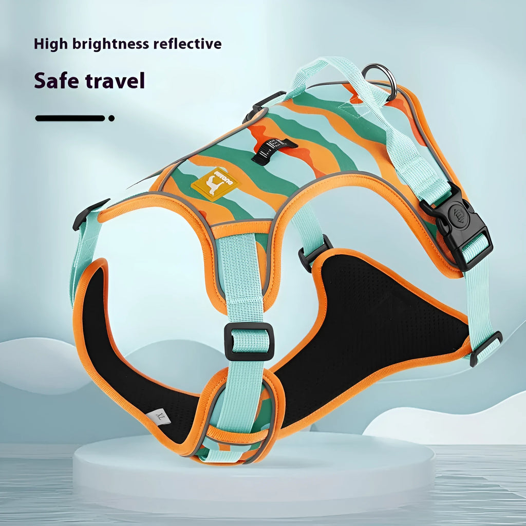 Reflective orange dog harness with chest and back rope attachments and a hand-holding lead.
