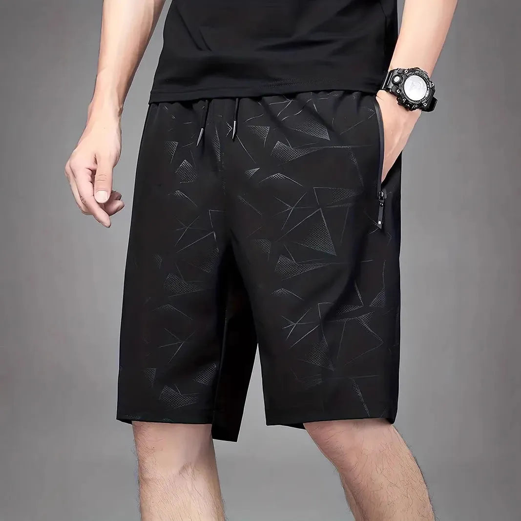 Men's loose fit polyester sports shorts in black colour with elastic waistband