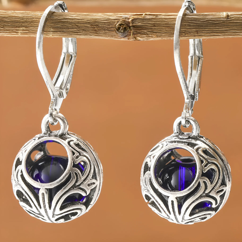 Silver-coloured vintage engraving hollow geometric pendant earrings with blue gemstone