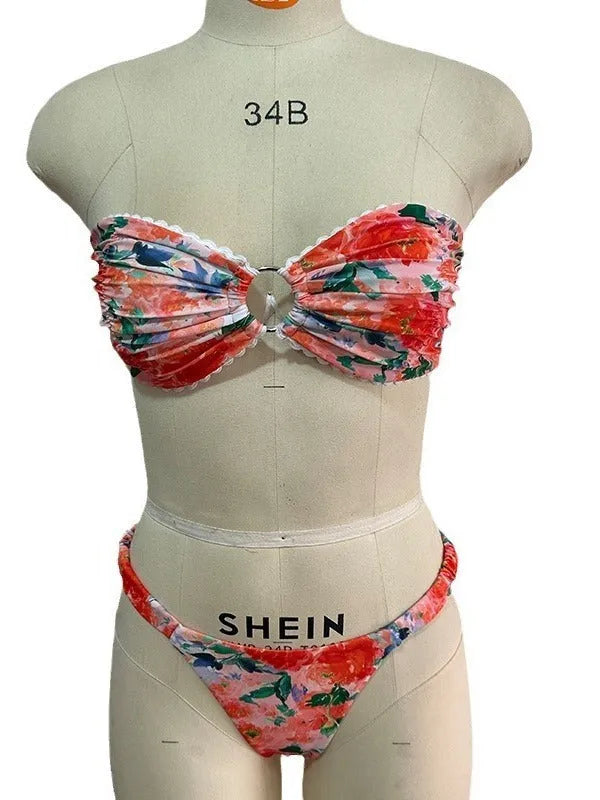 Floral printed lace bikini top in blue, shown as a sleeveless, backless tube top for swimming.