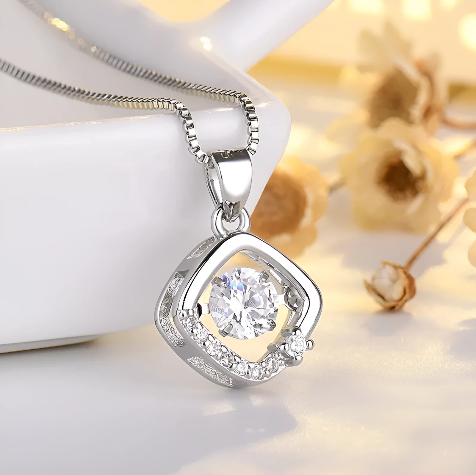 Silver heart-shaped pendant necklace with crown and bow charms for women