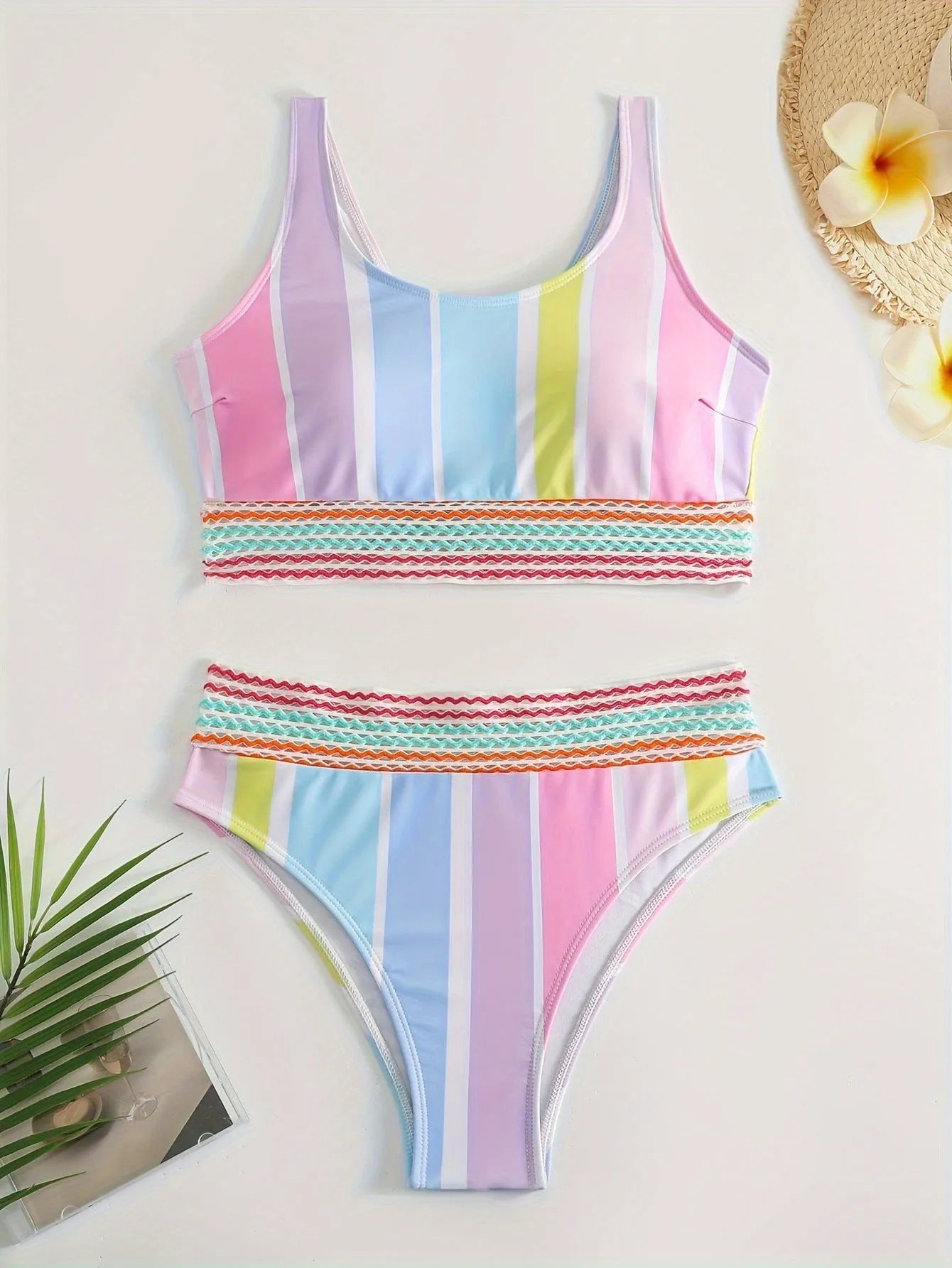Women's striped bikini top and briefs in picture colour, laid flat to show pattern and style.