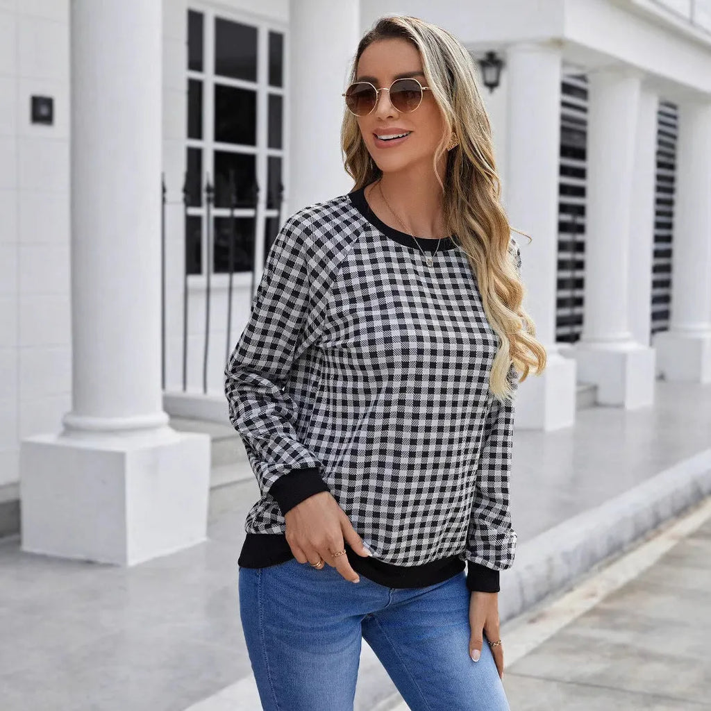 Black long sleeve pullover sweater with a Japanese sweet plaid and striped pattern.