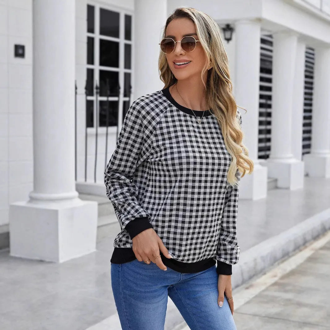 Black long sleeve pullover sweater with a Japanese sweet plaid and striped pattern.