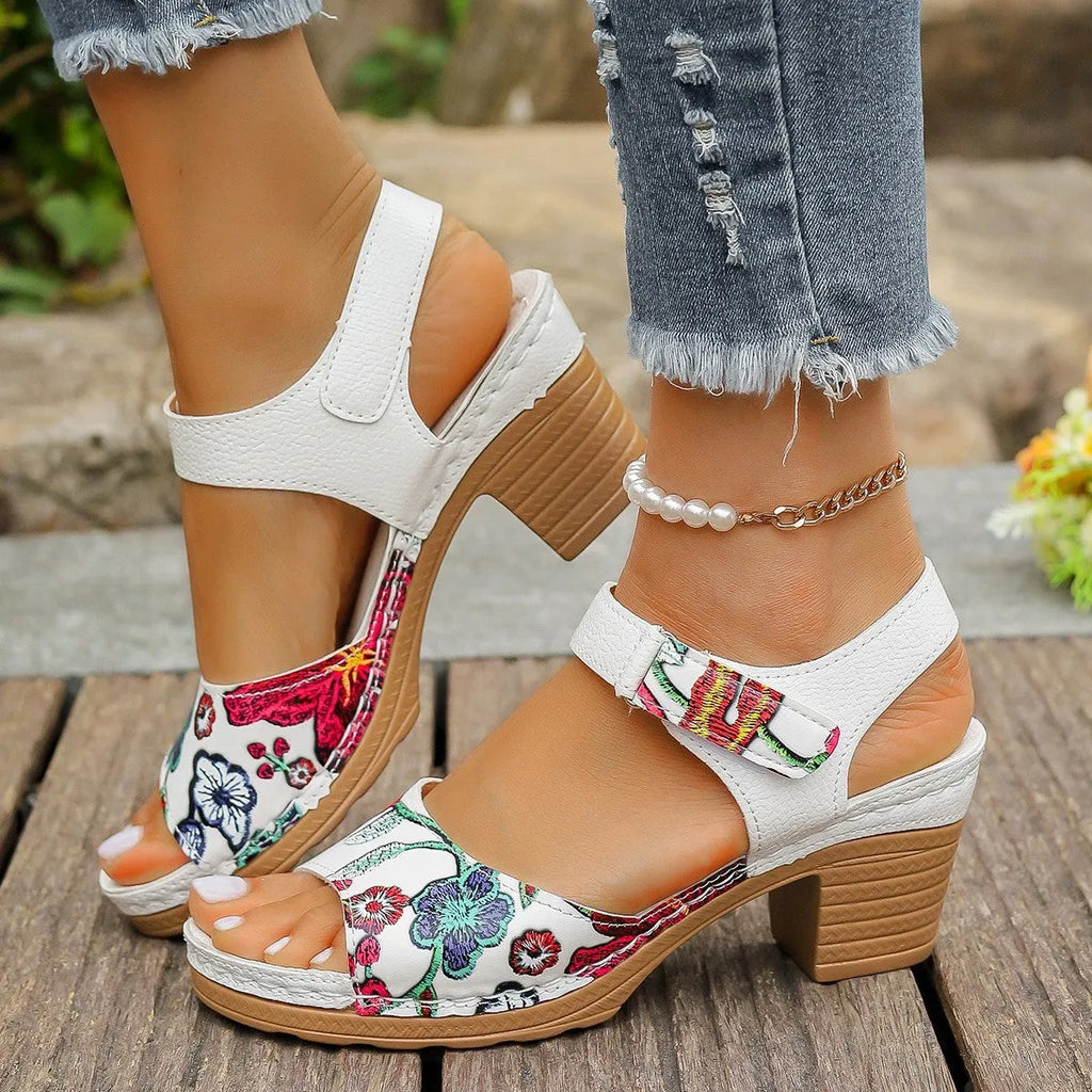 White women's high heel sandals with a Velcro buckle strap and rubber sole