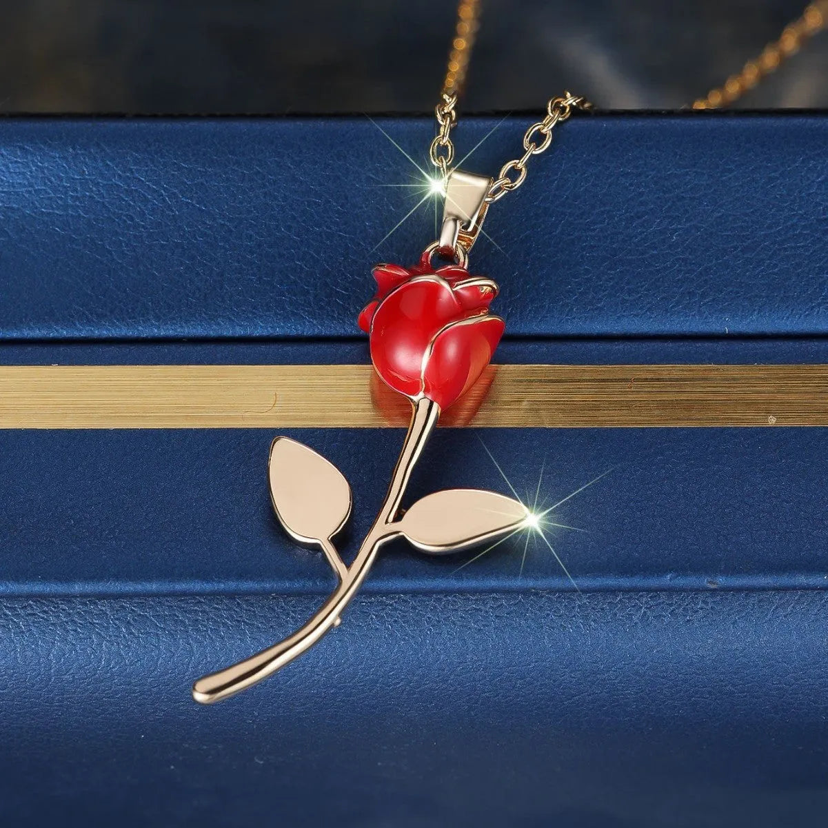 Champagne gold rose pendant necklace with copper drip oil finish and O-ring chain on display