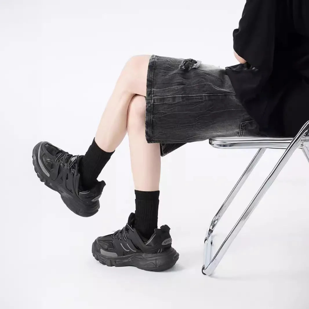 Retro washed denim shorts with loose fit and distressed ripped detailing in black or blue