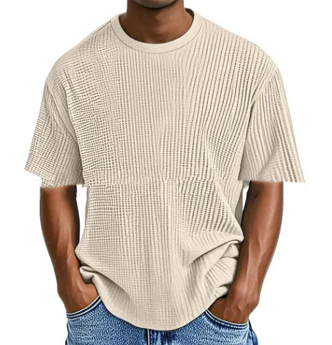 Man wearing a light blue cotton blend waffle knit short sleeve casual T-shirt.
