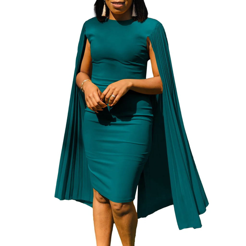 Woman wearing a long sleeve, high-waist evening gown with a pleated shawl draped over the shoulders.