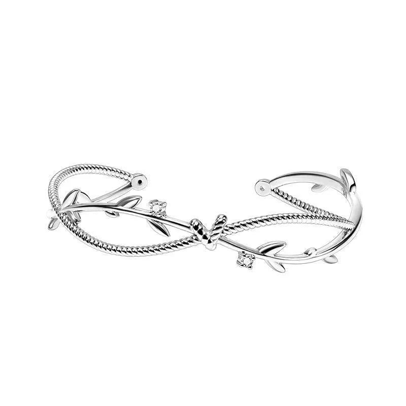 Twisted branch sprout bracelet in white gold finish with detailed copper construction