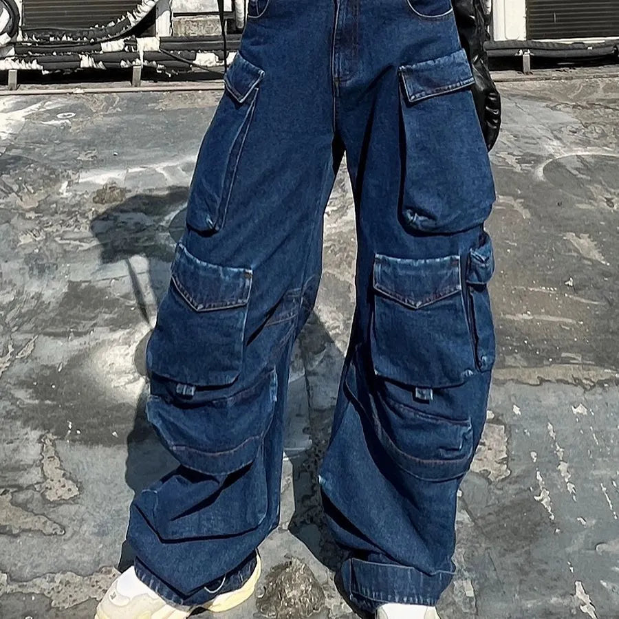 Dark blue distressed women's wide-leg jeans with a high waist and multiple pockets on a neutral background.