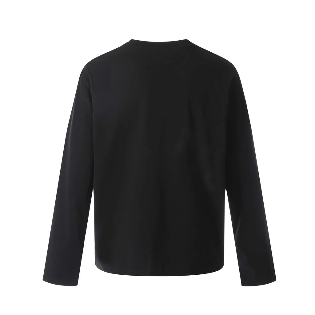 A man or woman wearing a loose grey cotton long sleeve retro pullover.